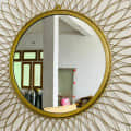 Engineered Iron Round Wall Mirror in Golden Colour - front_view
