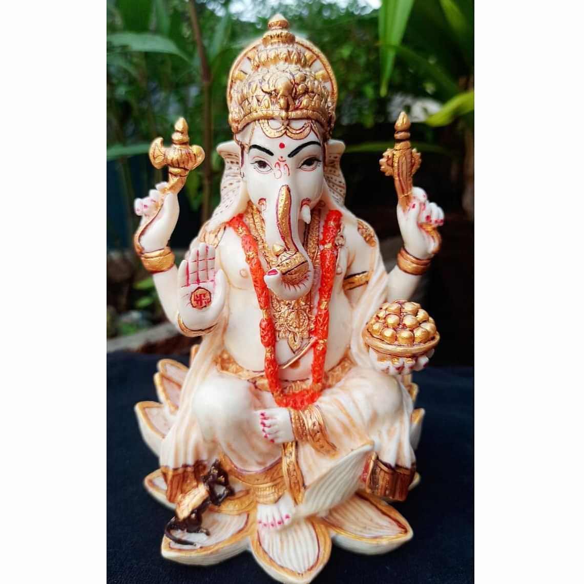 Lord Ganesha sitting on Lotus statue - photo