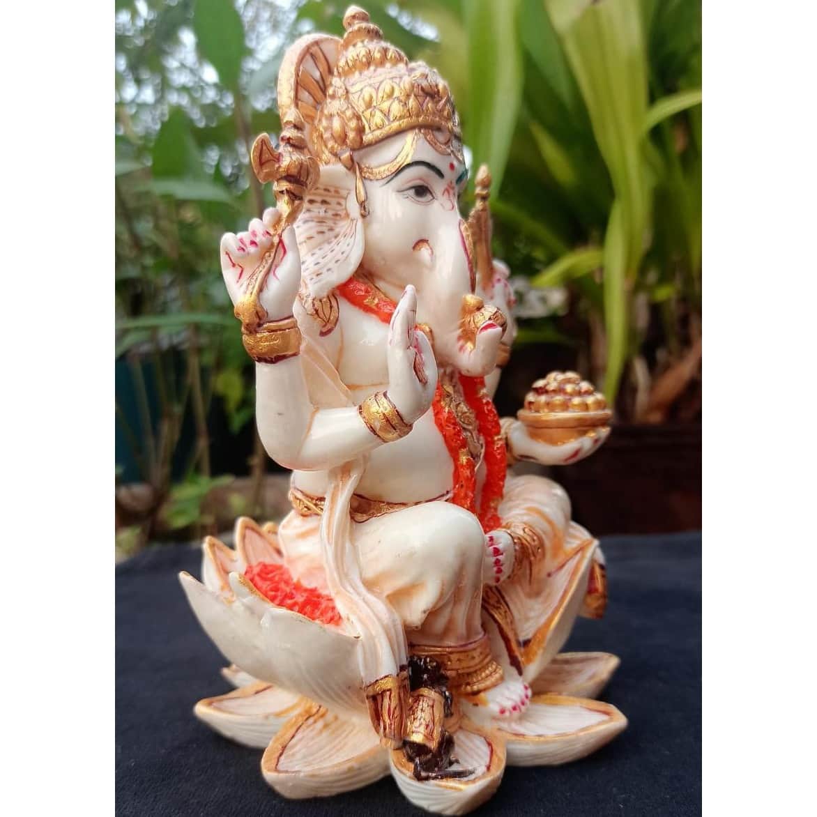 Lord Ganesha sitting on Lotus statue - left_view