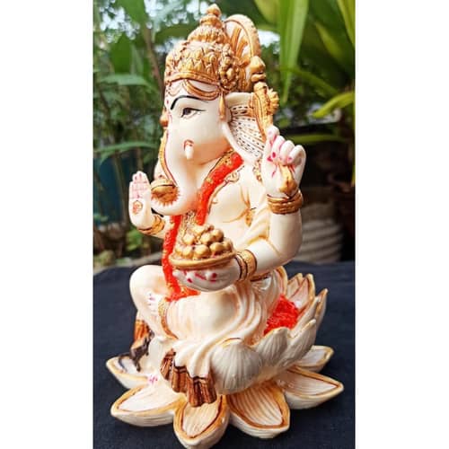 Lord Ganesha sitting on Lotus statue