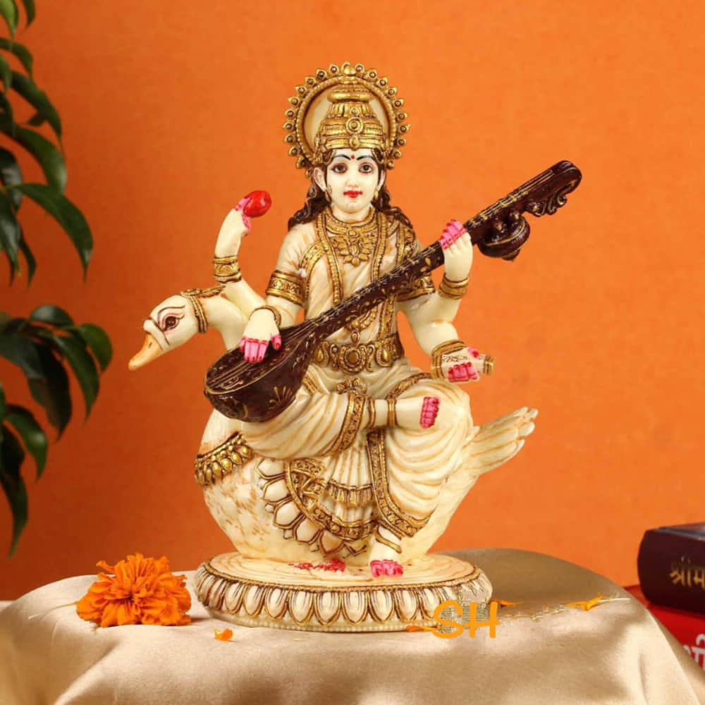 Lord Saraswati Statue Fine Gold Plating - photo
