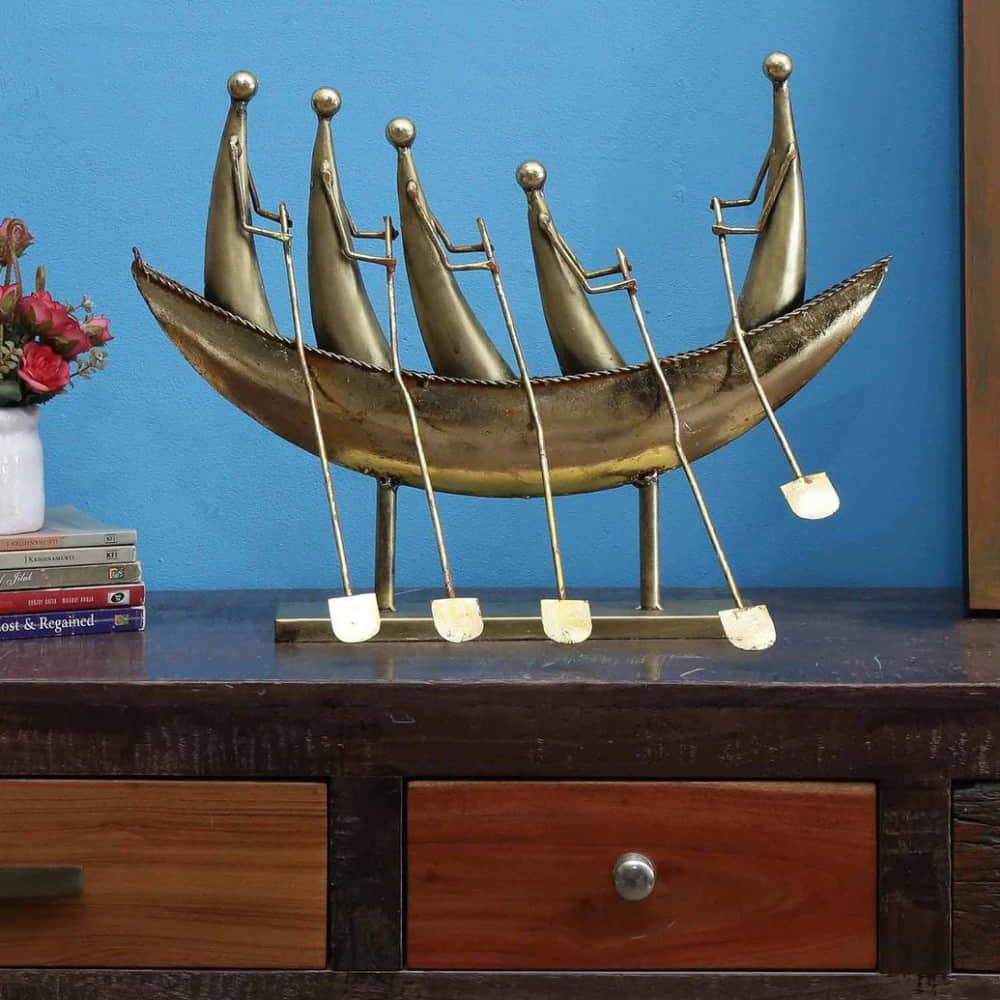 Iron Boat Traveller Figurine In Gold - photo