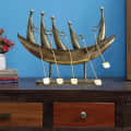 Iron Boat Traveller Figurine In Gold - photo