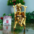 Metal Lord Ganesha Reading Ramayana Statue - photo
