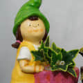 Resin Made Planter Statue Of Boy And Girl - top_view