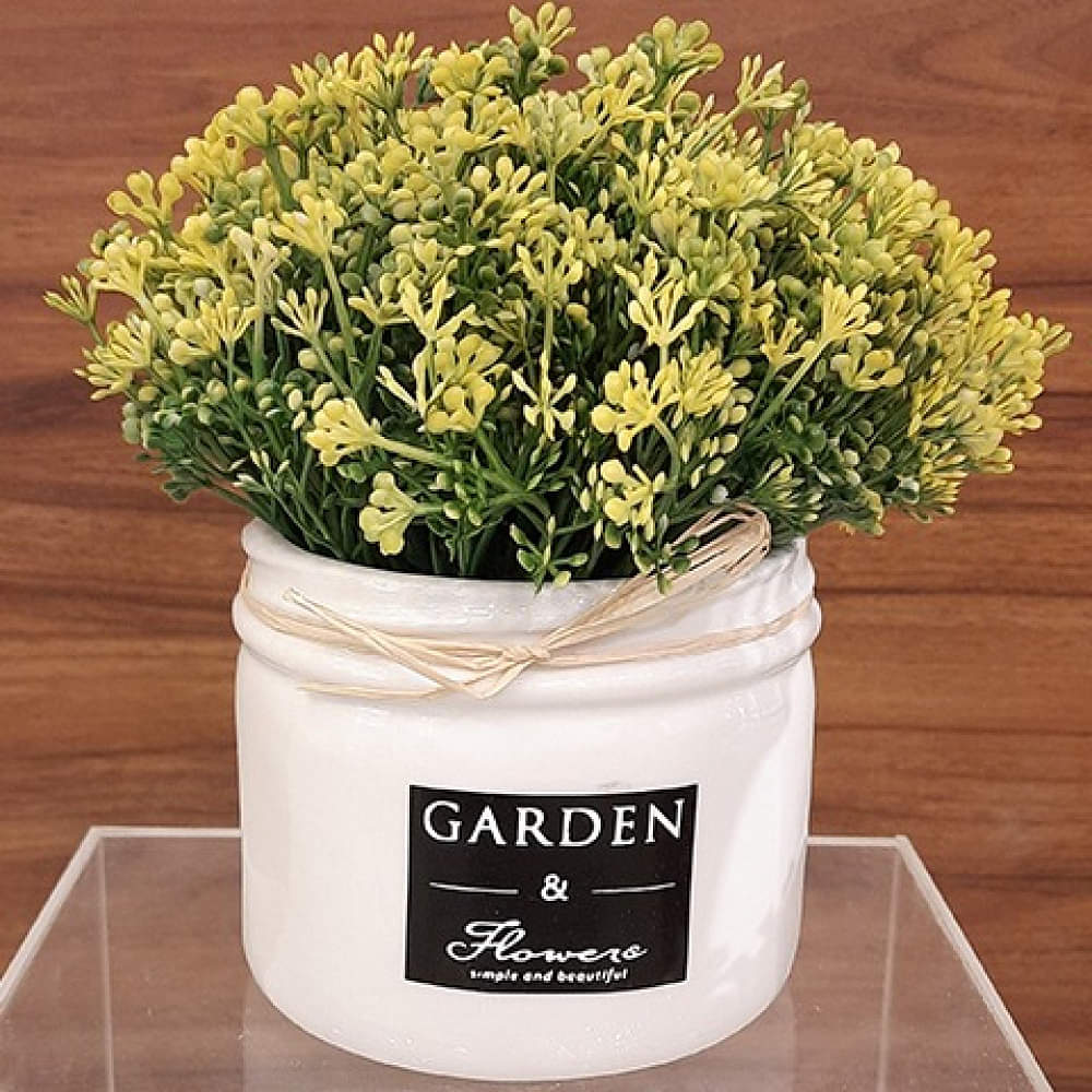 White Ceramic Pot With Small Artificial Flowers - photo