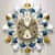 Metal Designer Clock With Sticks And Flaps - photo