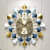 Metal Designer Clock With Sticks And Flaps - front_view